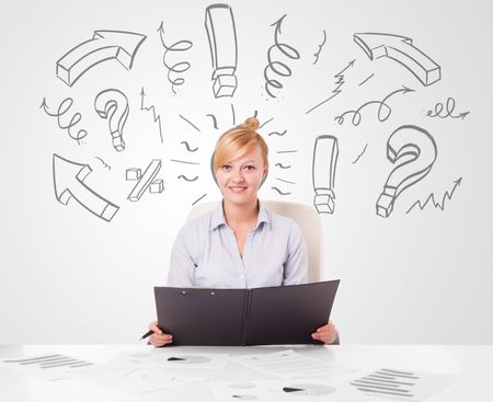Attractive young businesswoman brainstorming with drawn arrows and symbols