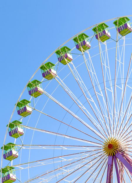 chicago wheel at a fun fair over a beautiful blue sky