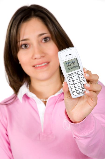 woman in pink showing a mobile phone over a white background