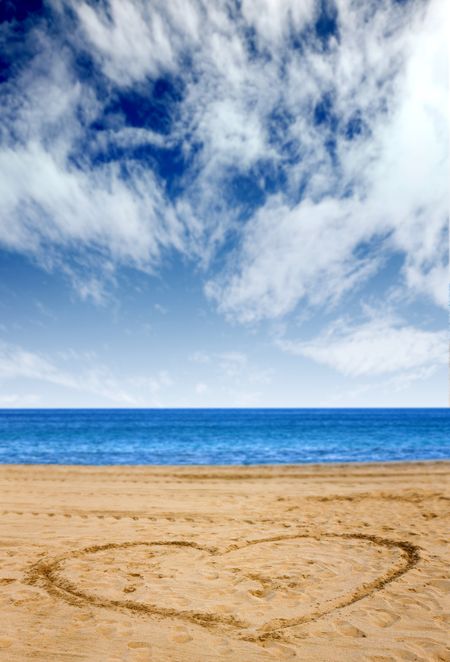 heart shape on the beach with a beautiful blue sky