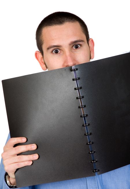 business man looking over a black book