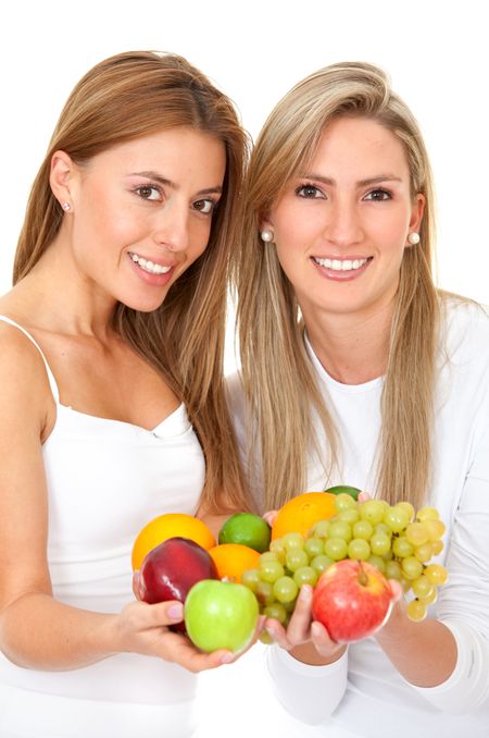 Women holding some fruits isolated over white