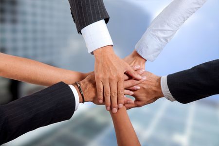 Business hands holding each other - togetherness concepts