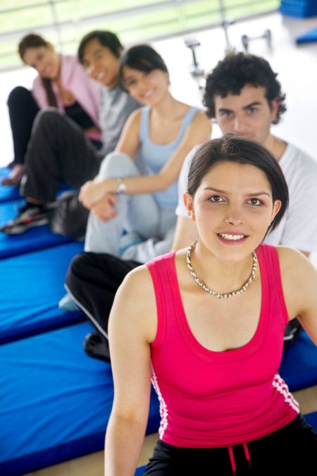 group of people at the gym sitting on mats