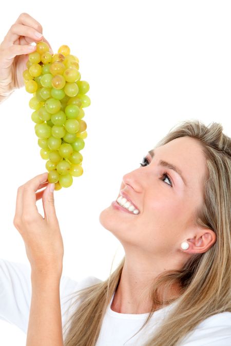 Healthy woman holding some grapes isolated