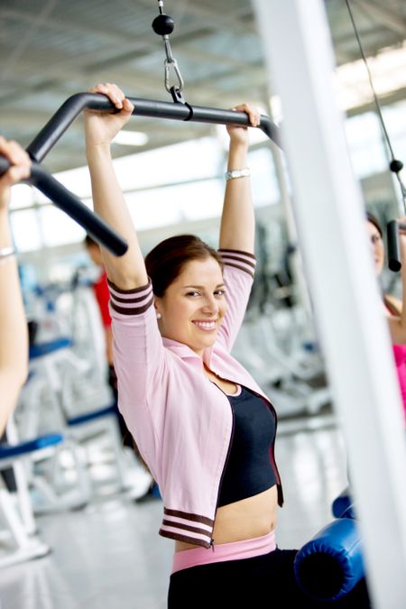 woman at the gym exercising on a machine