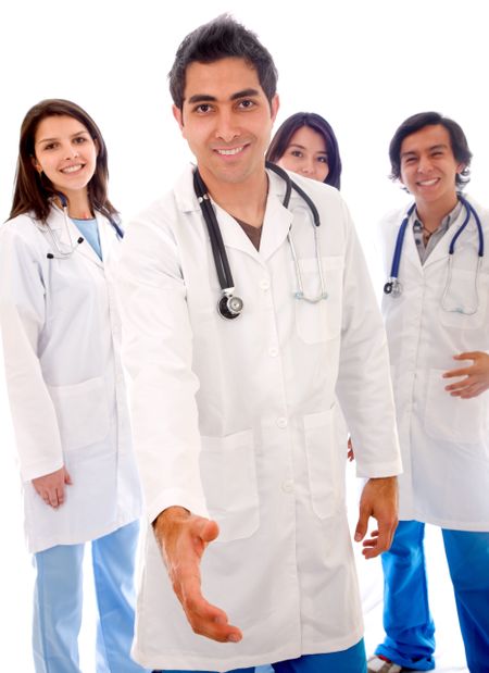 Male doctor with his  team behind him - isolated