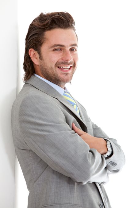 Portrait of an elegant businessman smiling isolated