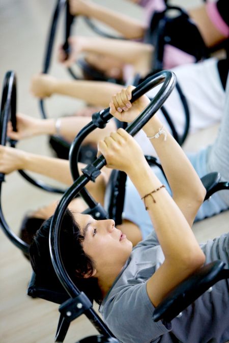 Image of a group working out on an abs machines