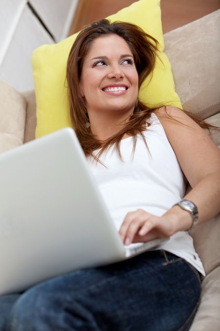 Beautiful woman working on her computer from home