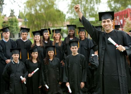 Large group of graduates standing outdoors