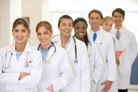 Group of doctors in a row at a hospital