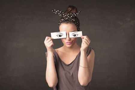 Silly youngster looking with hand drawn eye paper concept