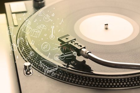 Turntable playing classical music with icon drawn instruments concept on background