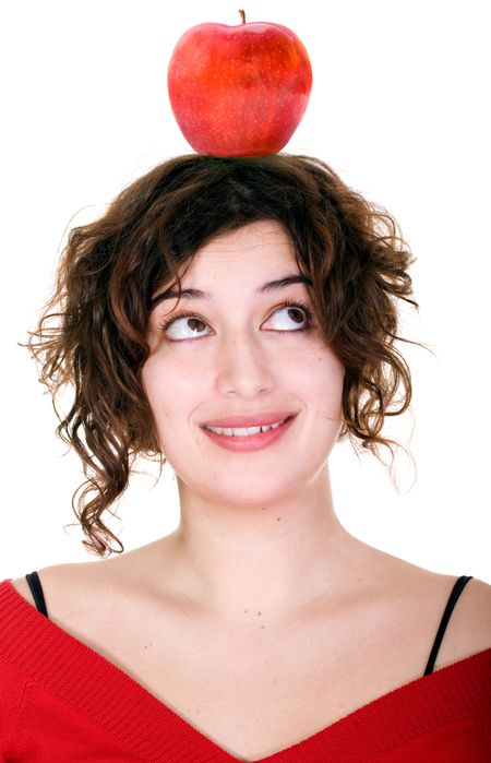 girl with an apple on her head over a white background