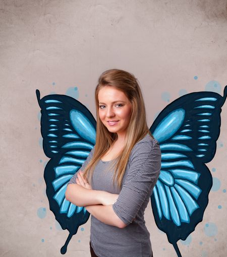 Cute young girl with butterfly blue illustration on the back