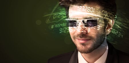 Business man looking at high tech number calculations concept