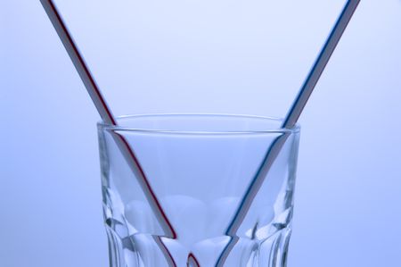 Two drinking straws in one glass