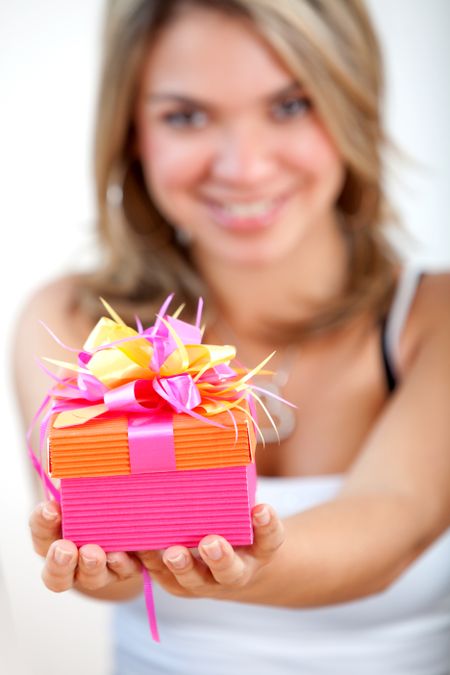 girl holding a gift box - isolated over white