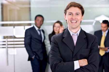 Businessman in an office with his team