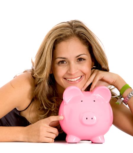 casual woman saving money in a piggybank - isolated