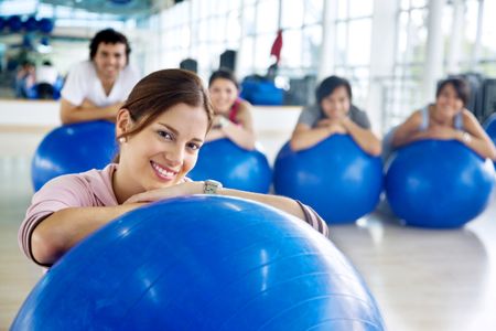 group of gym people at a pilates class