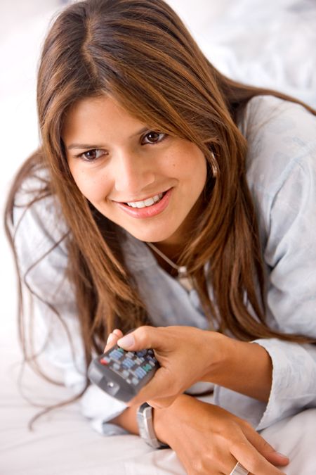Woman with a remote control in her hands