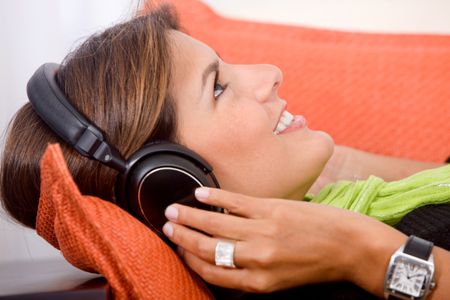 Woman relaxing with headphones listening to music