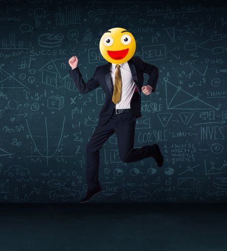 Funny businessman wears yellow smiley face