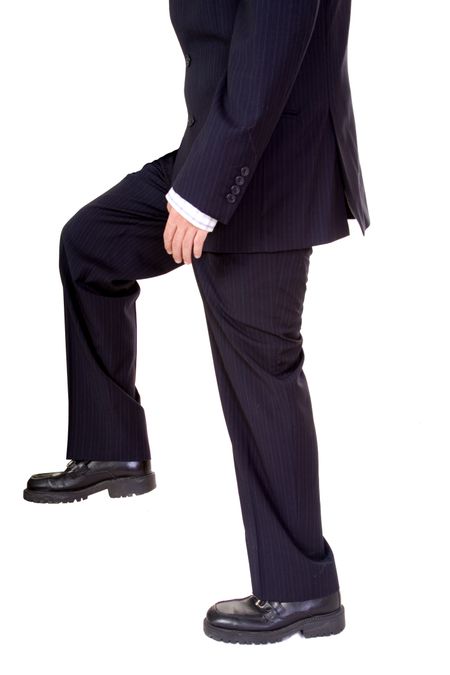 business man climbing something over a white background
