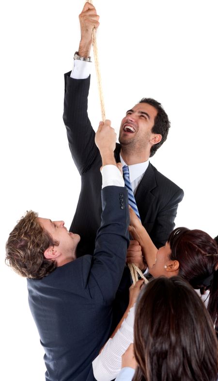 Business man climbing through a rope