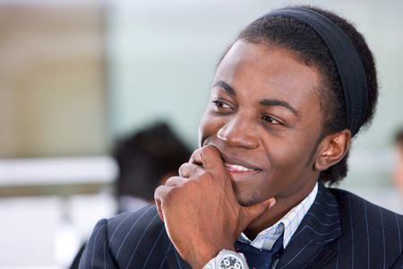 black thoughtful business man at an office
