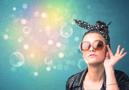 Young woman with sunglasses and bokeh colourful lights concept