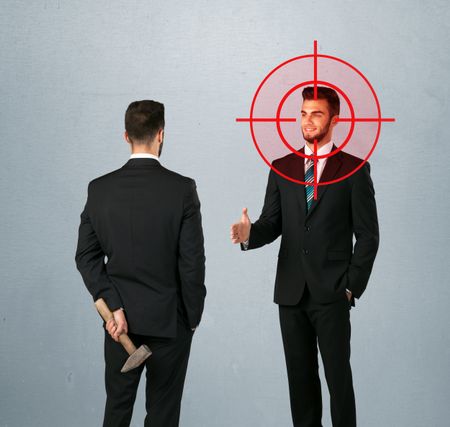 ruthless-businessman-handshake-hiding-weapon-head-278622101 Ruthless businessman handshake with a hiding weapon and a head target point