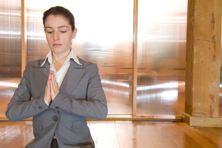 Close up of business woman in prayer