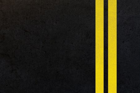 asphalt background with double yellow lines