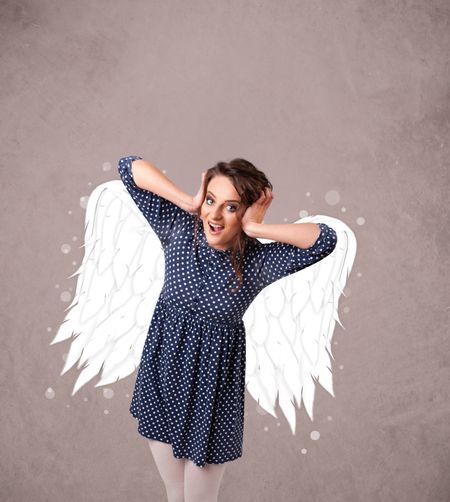 Cute person with angel illustrated wings on grungy background