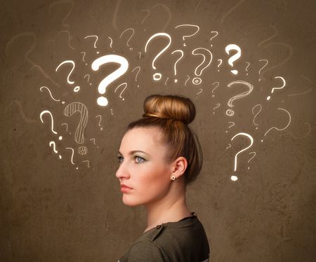 Teenage girl with question mark symbols around her head