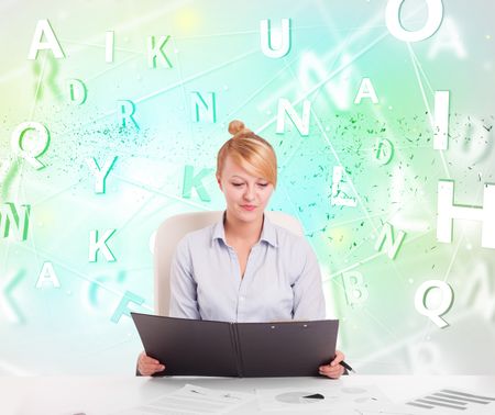 Business woman at white desk with green word cloud