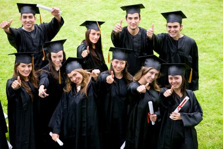 happy graduation students with thumbs up