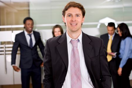 Businessman in an office with his team
