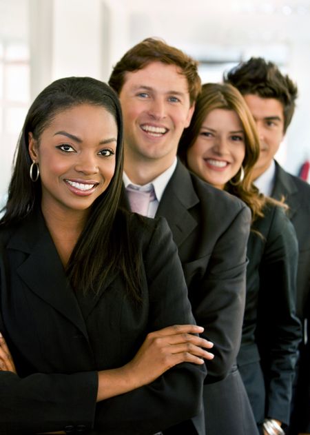 group of business people smiling in an office