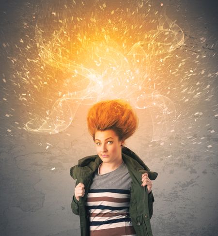 young-woman-energetic-exploding-red-hair-282641108 Young woman with energetic exploding red hair concept on background