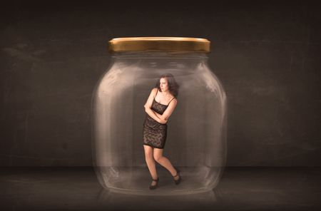 Businesswoman captured in a glass jar concept concept on background