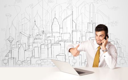 Businessman sitting at the white table with hand drawn buildings in the background