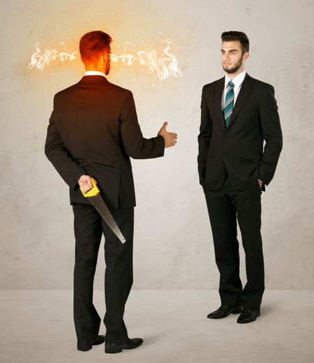 angry-businessman-hiding-weapon-back-282655373 Angry businessman hiding a weapon behind his back