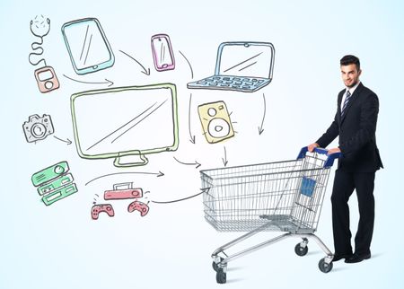 Businessman pushing a shopping cart drawn media devices coming out of it
