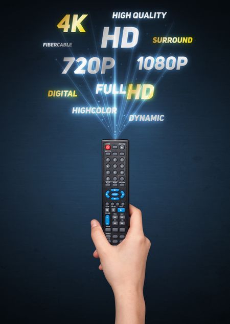 Hand holding a remote control, multimedia properties coming out of it

