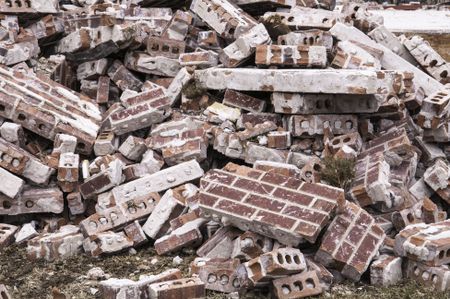Aftermath of violent storm: Pile of brick rubble from a single-family house destroyed by a tornado in Illinois