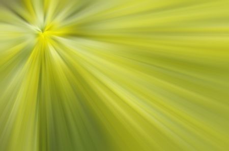 Abstract radial blur, mostly yellow and green, for background with themes of origin, revelation, illumination